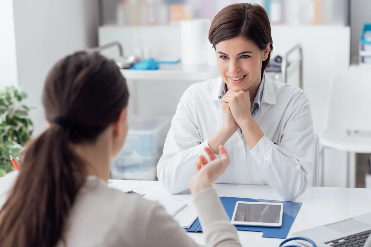Doctor listening to a patient during a consultation
